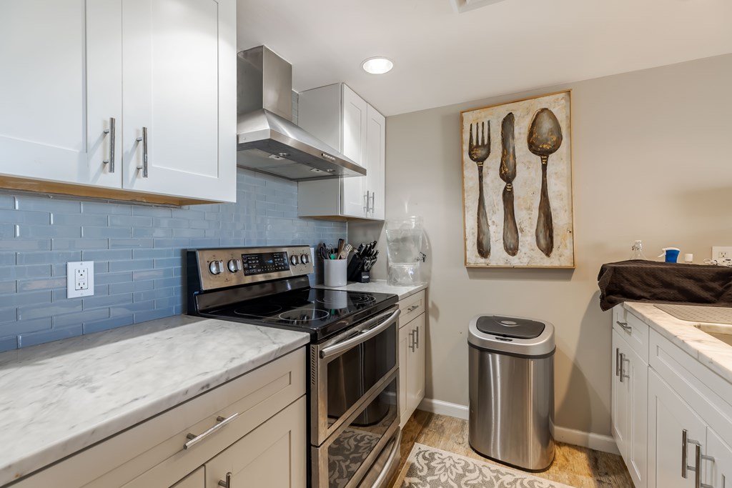 1006-3d Guadalupe Street Kerrville, TX 78028 - Photo 8 of 24 a kitchen with a sink and a stove top oven
