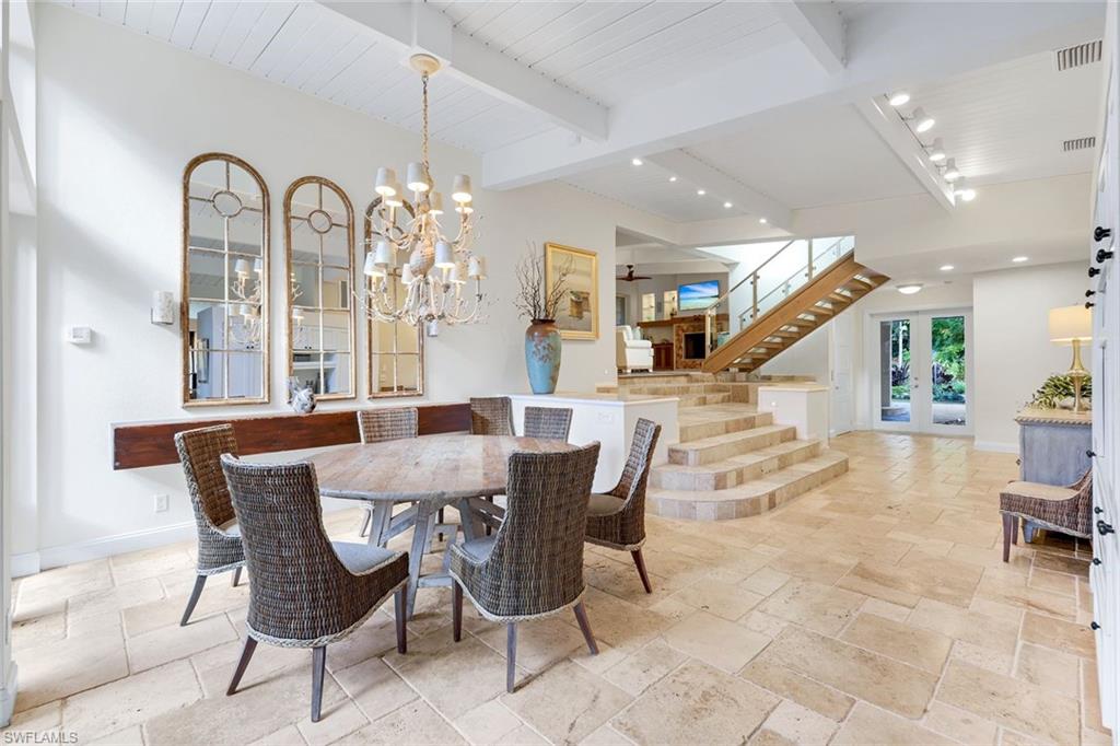 210 Central Avenue Naples, FL 34102 - Photo 1 of 50 a view of a dining room with furniture and a chandelier