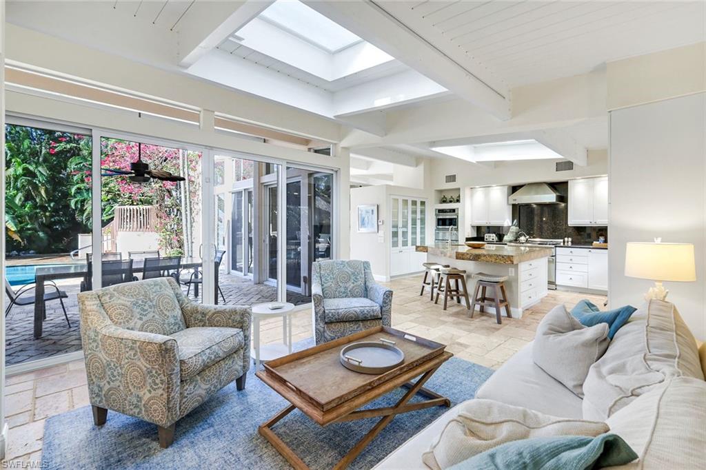210 Central Avenue Naples, FL 34102 - Photo 12 of 50 a living room with furniture and view of kitchen