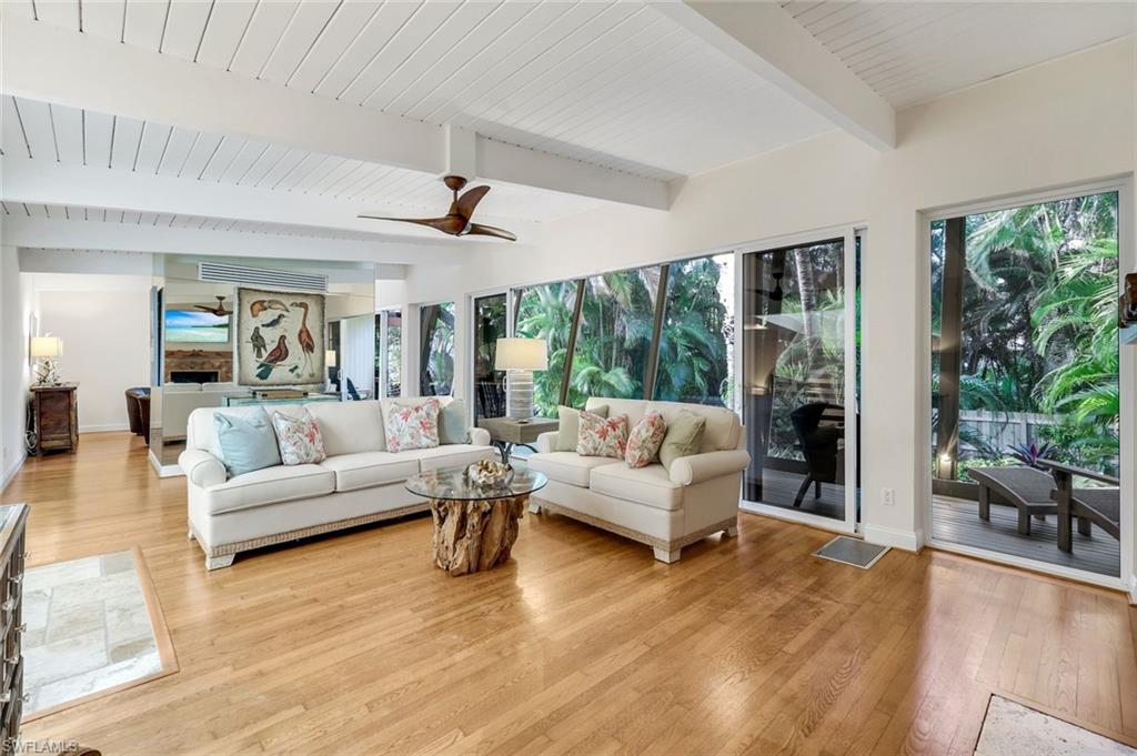 210 Central Avenue Naples, FL 34102 - Photo 22 of 50 a living room with furniture and a large window