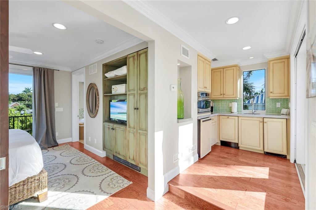 210 Central Avenue Naples, FL 34102 - Photo 33 of 50 a view of a kitchen with refrigerator and window