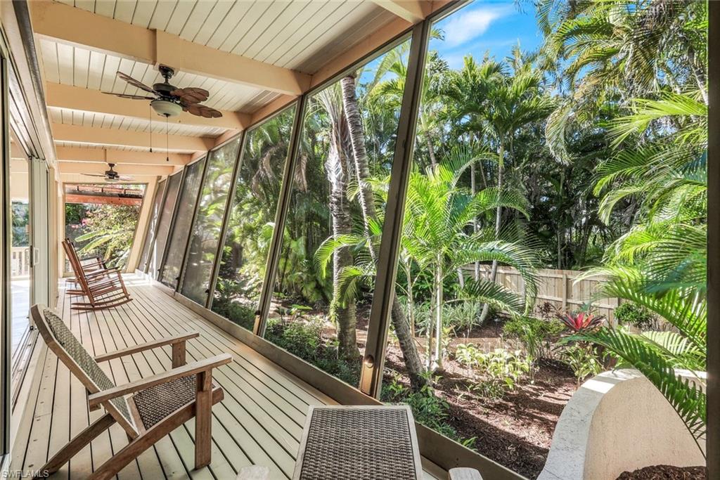 210 Central Avenue Naples, FL 34102 - Photo 39 of 50 a view of balcony with wooden floor