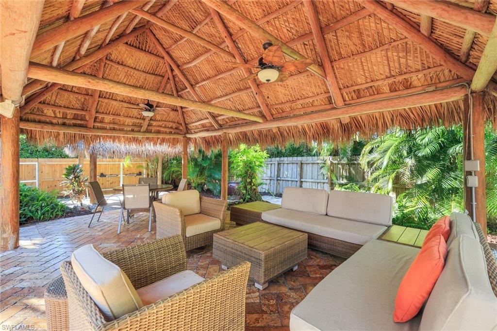 210 Central Avenue Naples, FL 34102 - Photo 46 of 50 a view of a patio with couches and pool