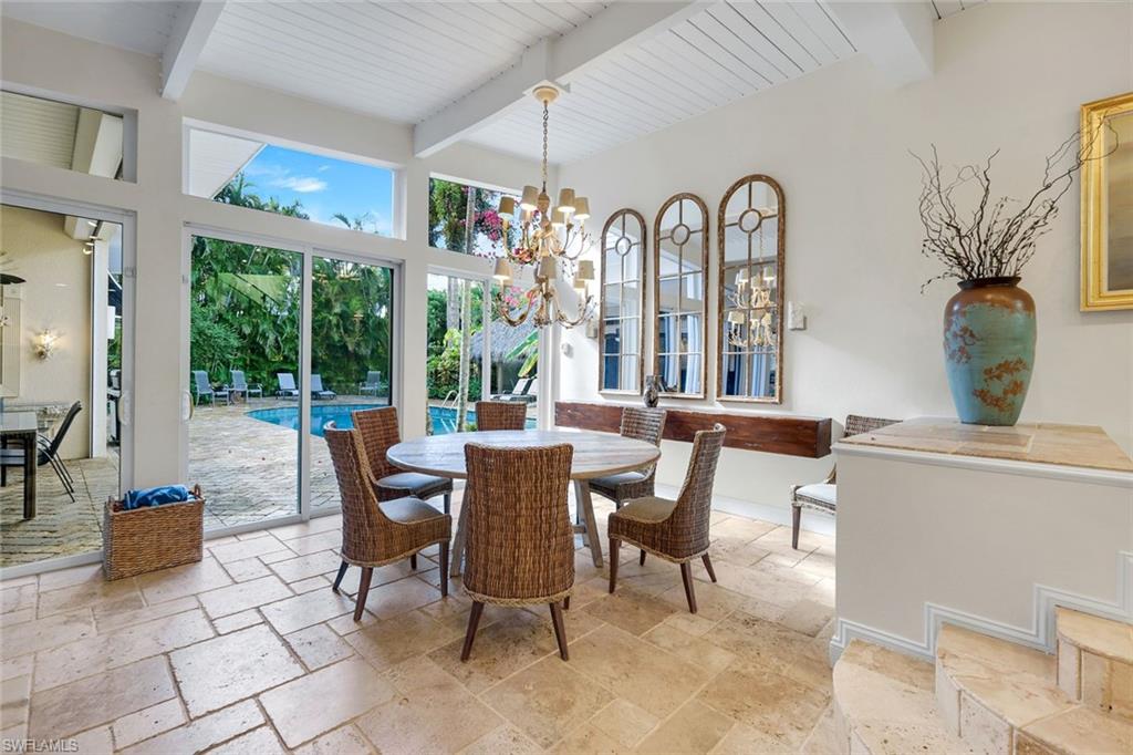 210 Central Avenue Naples, FL 34102 - Photo 7 of 50 a view of a dining room with furniture window and outside view