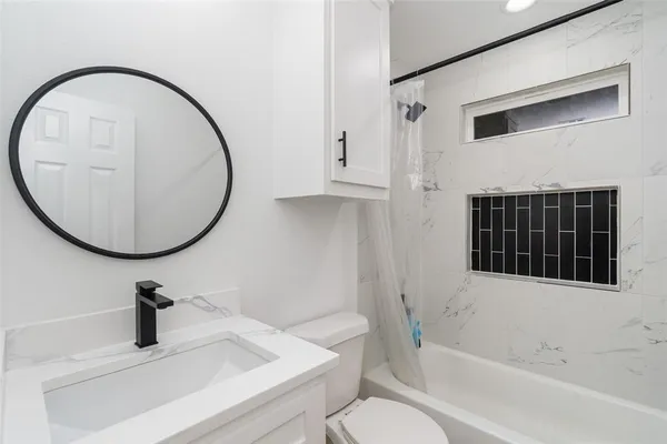 a view of a backyard with a fence