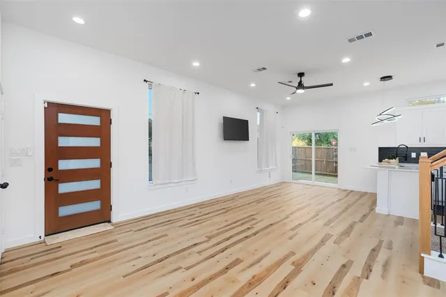 a kitchen with a sink a stove and refrigerator