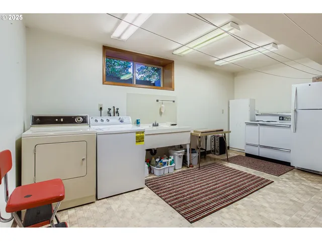 a room with furniture a rug and a fireplace