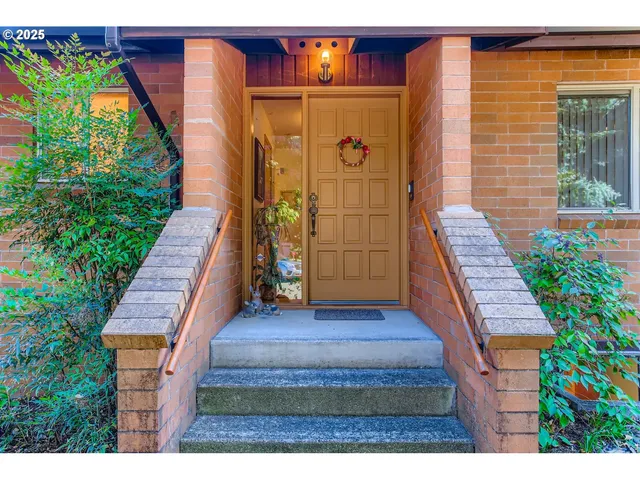 a view of front door of house with stairs