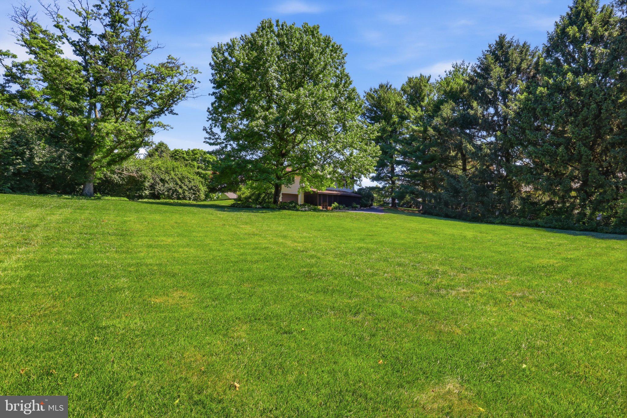 2381 Ridge Road Glenville, PA 17329 - Photo 44 of 58 Lush green expanse under clear skies.