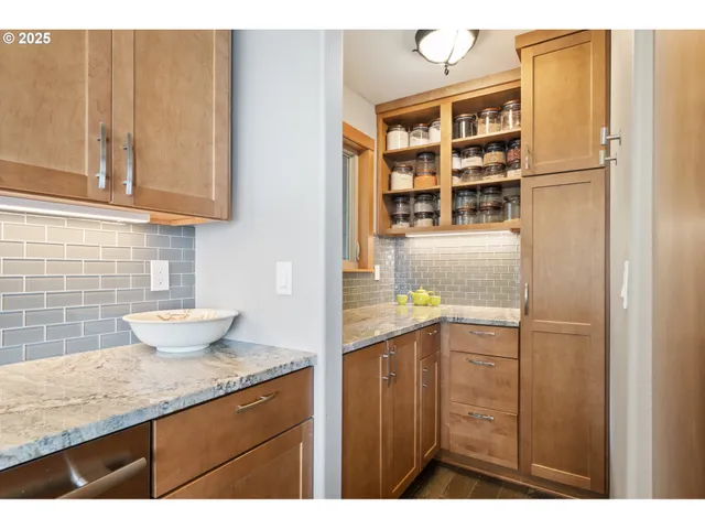 a kitchen with a sink and cabinets