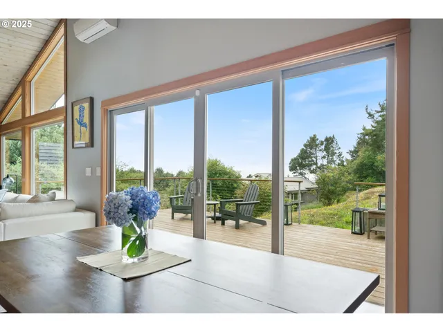 a view of living room with furniture and garden view