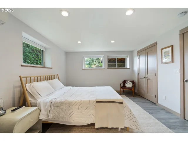 a bedroom with a bed and a couch