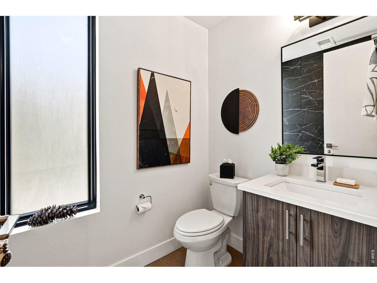 2467 Walnut Street Boulder, CO 80302 - Photo 28 of 49 Convenient powder room on the main floor, featuring an upgraded tile wall feature.