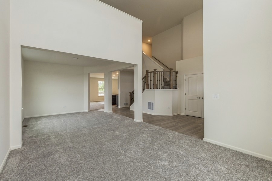 3616 Edelweiss Road Elgin, IL 60124 - Photo 2 of 26 a view of a big room with closet and windows