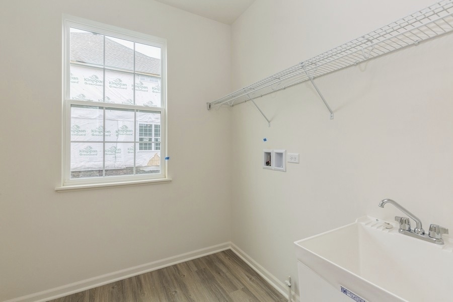 3616 Edelweiss Road Elgin, IL 60124 - Photo 12 of 26 a bathroom with a sink and cabinets