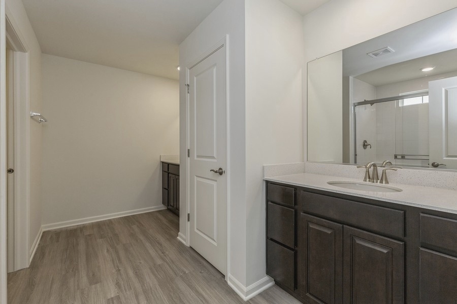 3616 Edelweiss Road Elgin, IL 60124 - Photo 15 of 26 a bathroom with a sink and mirror