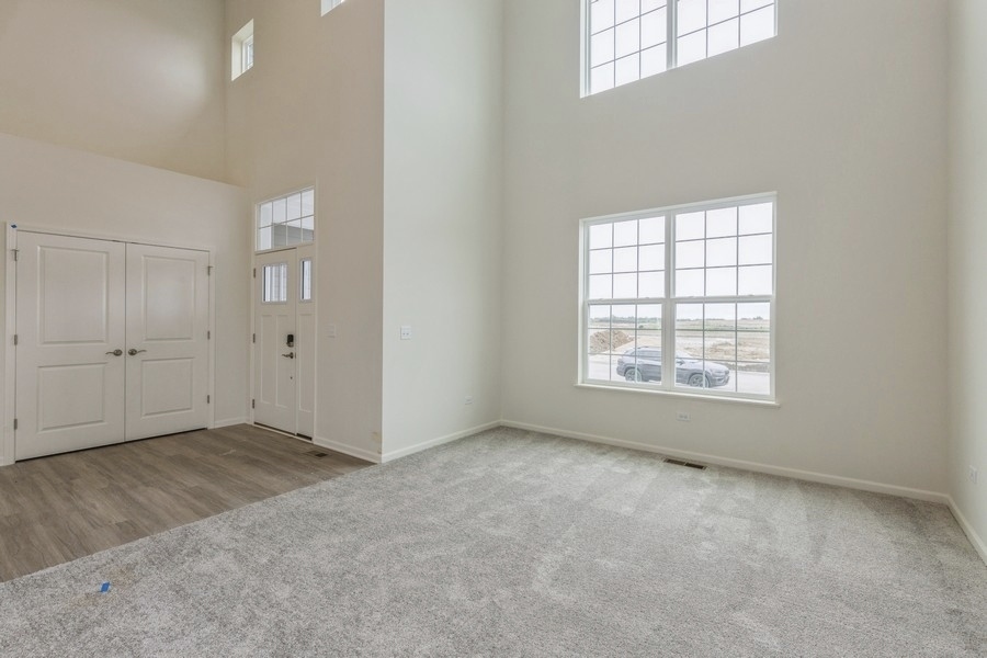3616 Edelweiss Road Elgin, IL 60124 - Photo 3 of 26 an empty room with windows