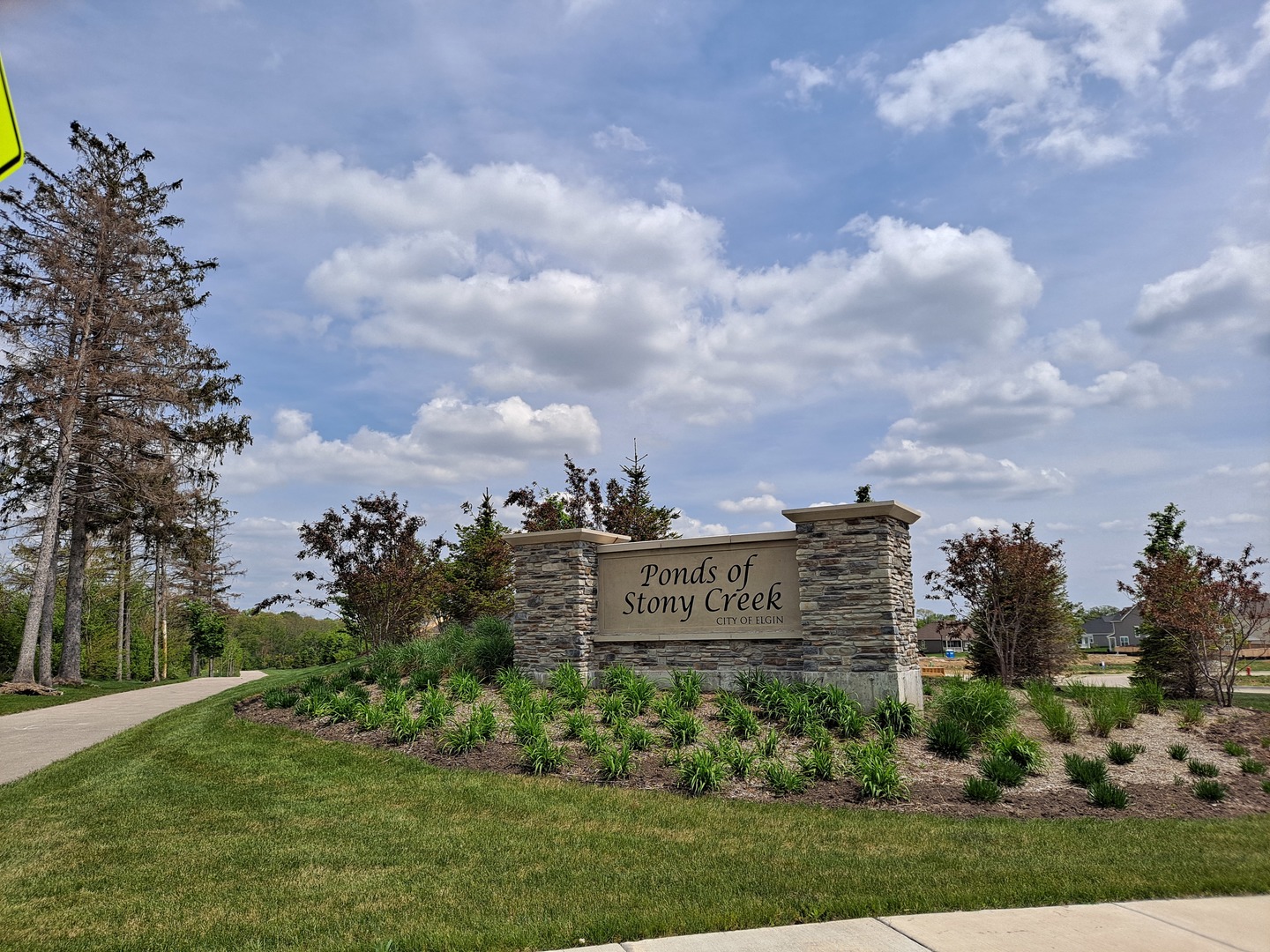 3616 Edelweiss Road Elgin, IL 60124 - Photo 21 of 26 a sign on the side of the grass
