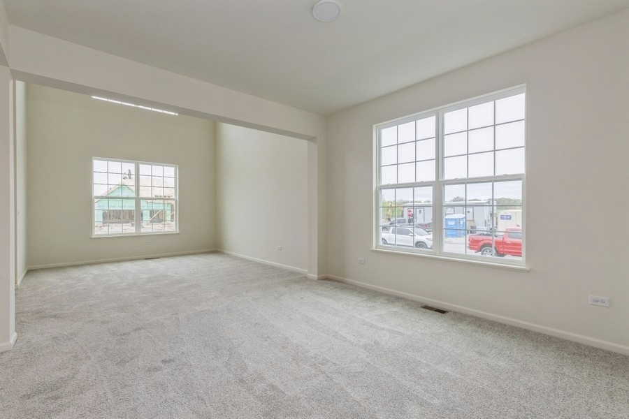 3616 Edelweiss Road Elgin, IL 60124 - Photo 5 of 26 an empty room with windows