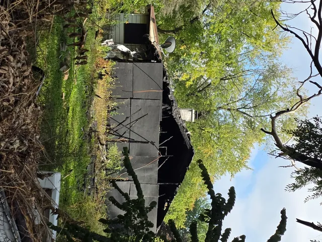 a backyard of a house with lots of green space