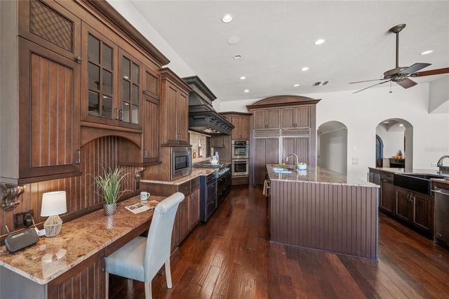 a living room with couch and a large window with outer view