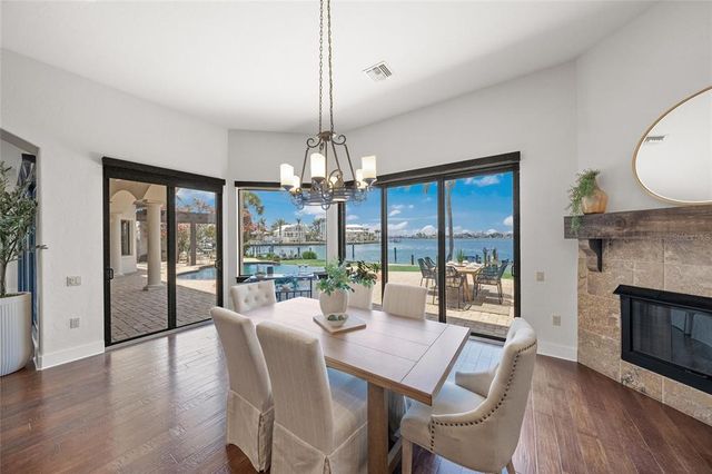 a bathroom with a granite countertop toilet a sink and a mirror