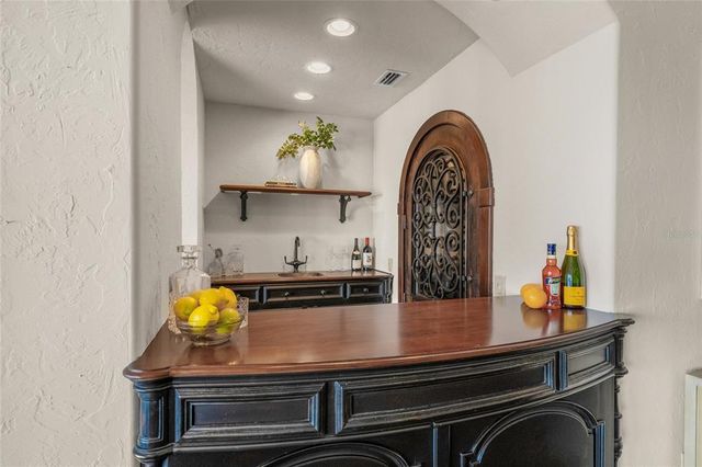 a bathroom with a granite countertop sink vanity and mirror