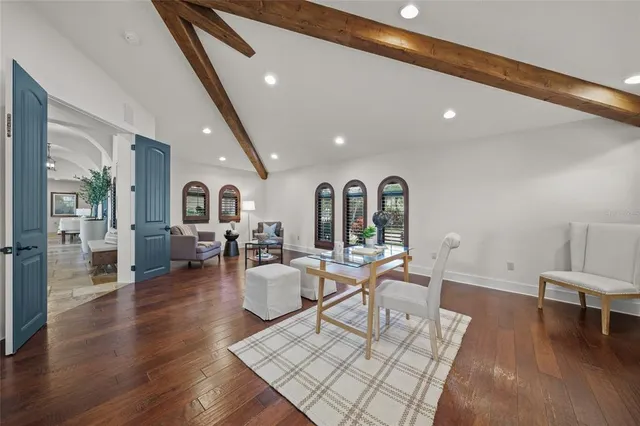 a view of swimming pool with outdoor seating and plants