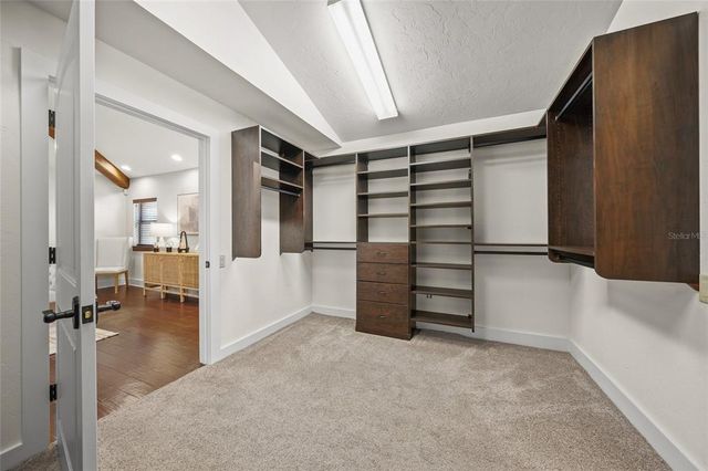 a view of a backyard with sitting area