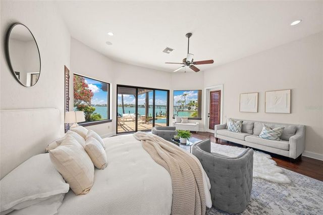 an aerial view of residential houses with outdoor space and river