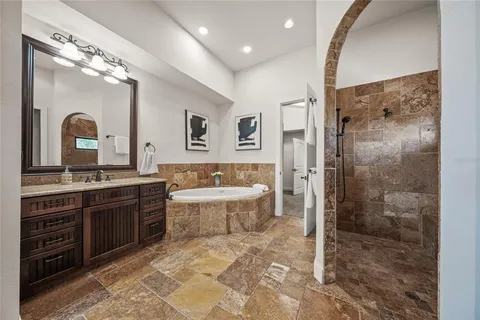 a front view of house with a yard and potted plants