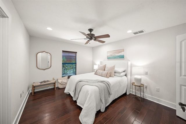 a living room with fireplace furniture and a large window