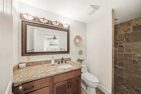 a living room with furniture large window and fireplace