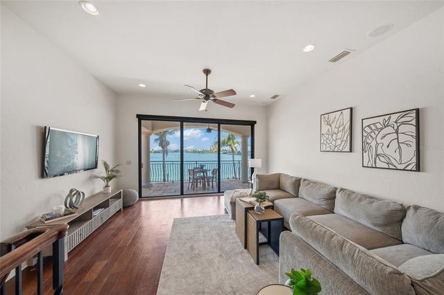 a view of a dining room with furniture wooden floor and chandelier