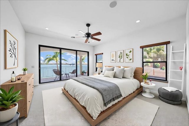 a balcony with furniture and a potted plant