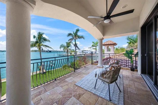 a view of swimming pool with a table and chairs