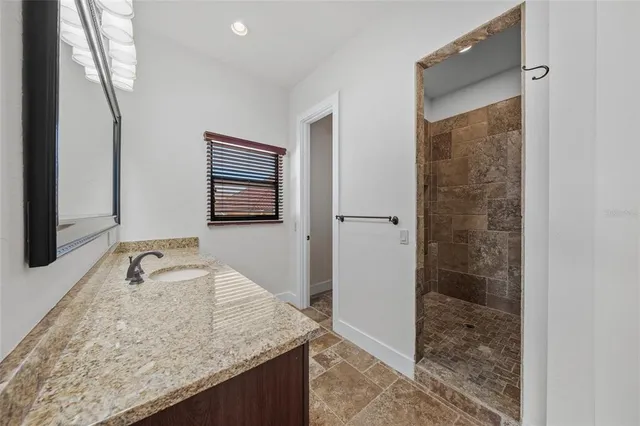 an aerial view of house with yard and lake view