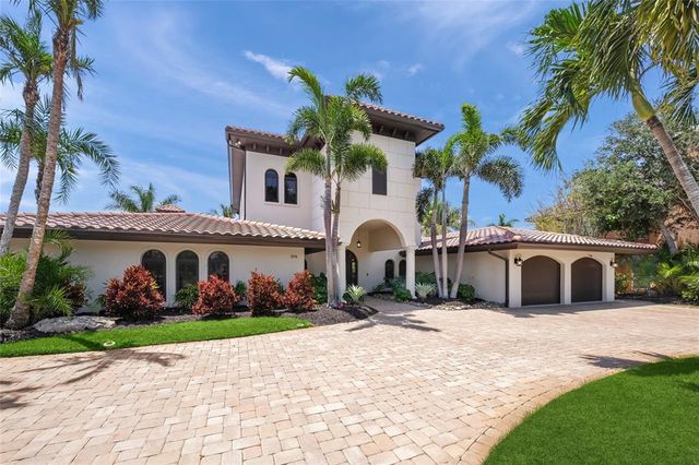 a view of a dining room with furniture wooden floor and chandelier