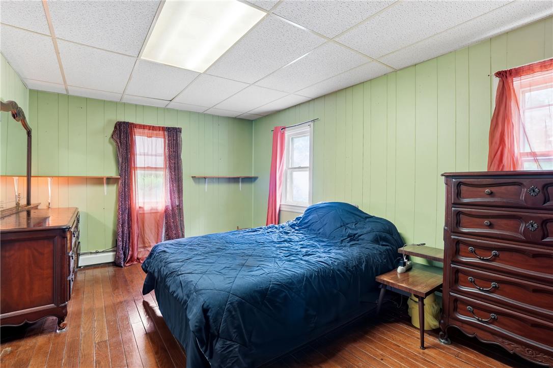 3573 Lower Saucon Road Hellertown, PA 18055 - Photo 17 of 56 Gleaming hardwood floors and classic wood paneling define this versatile secondary bedroom space.