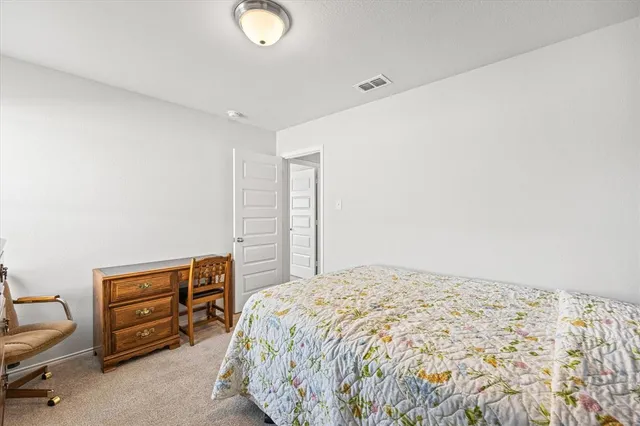 a bedroom with a bed and a cabinets