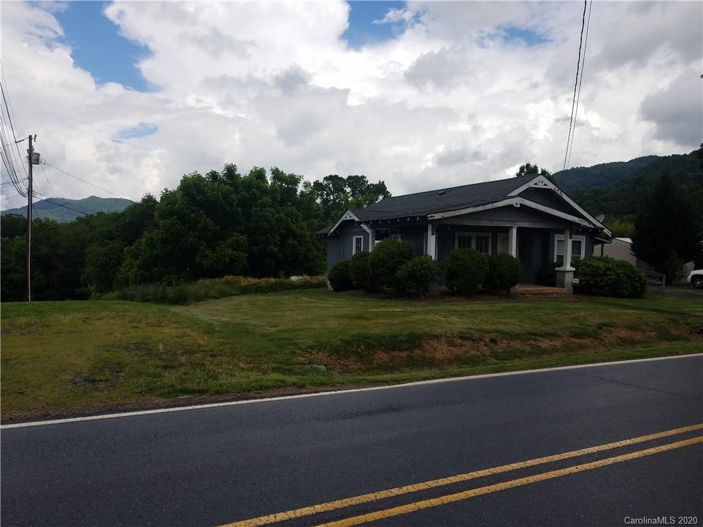 1003 North Canton Road Canton, NC 28716 - Photo 5 of 48 a front view of a house with a garden