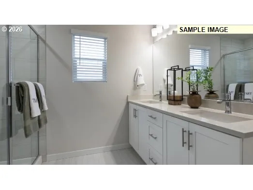 a bathroom with a sink a mirror and shower