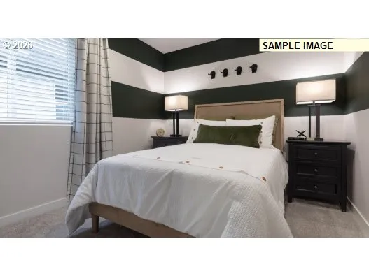 a bedroom with a bed and a night stand