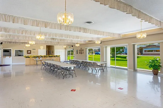 a living room with furniture or outdoor view and a large window