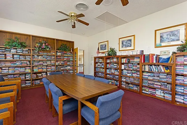 a room with gym equipment and windows