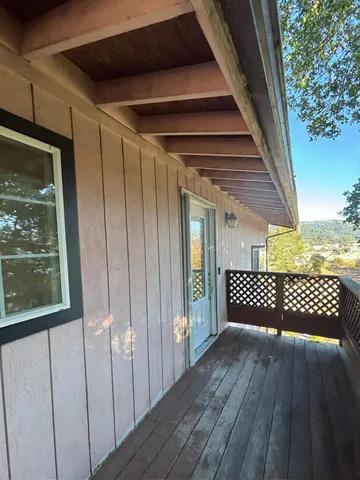 a view of a wooden door with a glass door