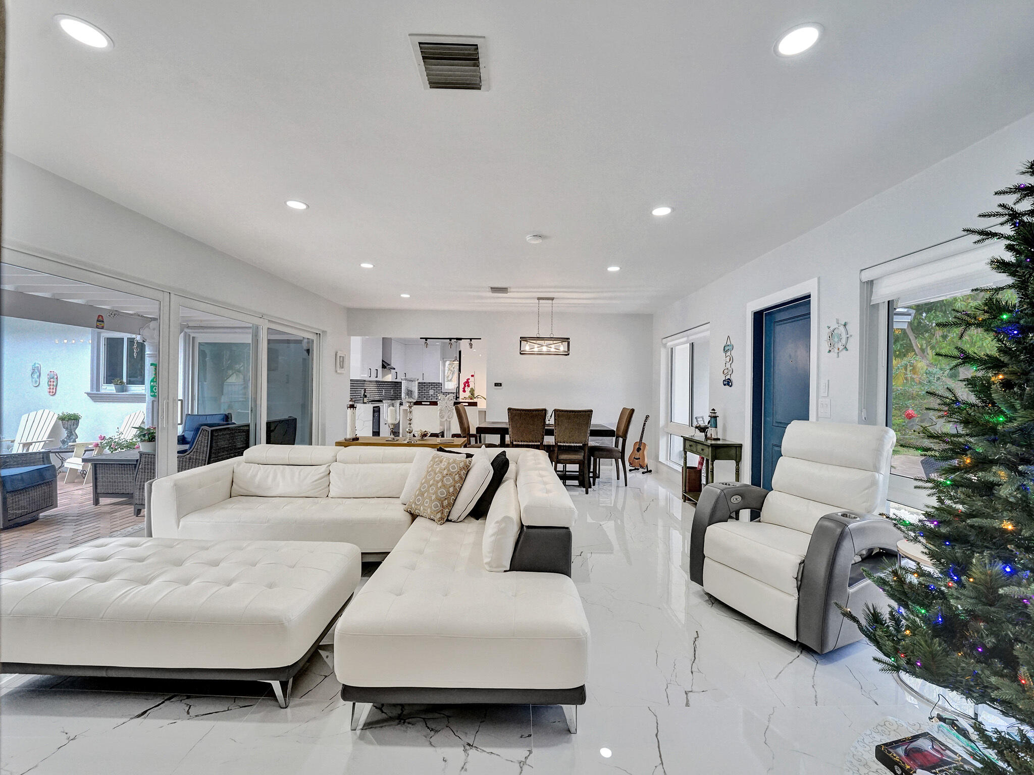 3204 Robbins Road Pompano Beach, FL 33062 - Photo 11 of 37 a living room with furniture and a large window