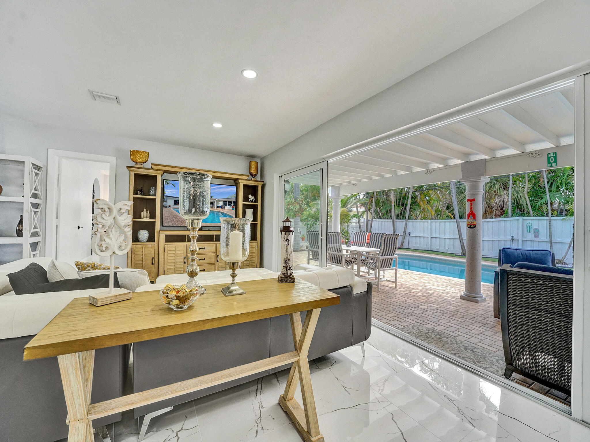 3204 Robbins Road Pompano Beach, FL 33062 - Photo 12 of 37 a room with stainless steel appliances kitchen island granite countertop a sink and cabinets