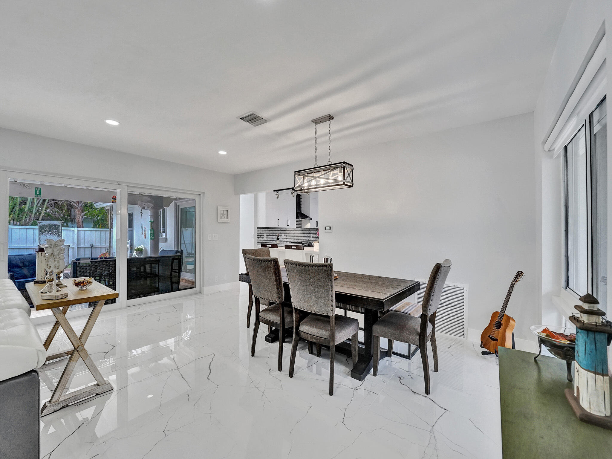 3204 Robbins Road Pompano Beach, FL 33062 - Photo 13 of 37 a view of a dining room with furniture