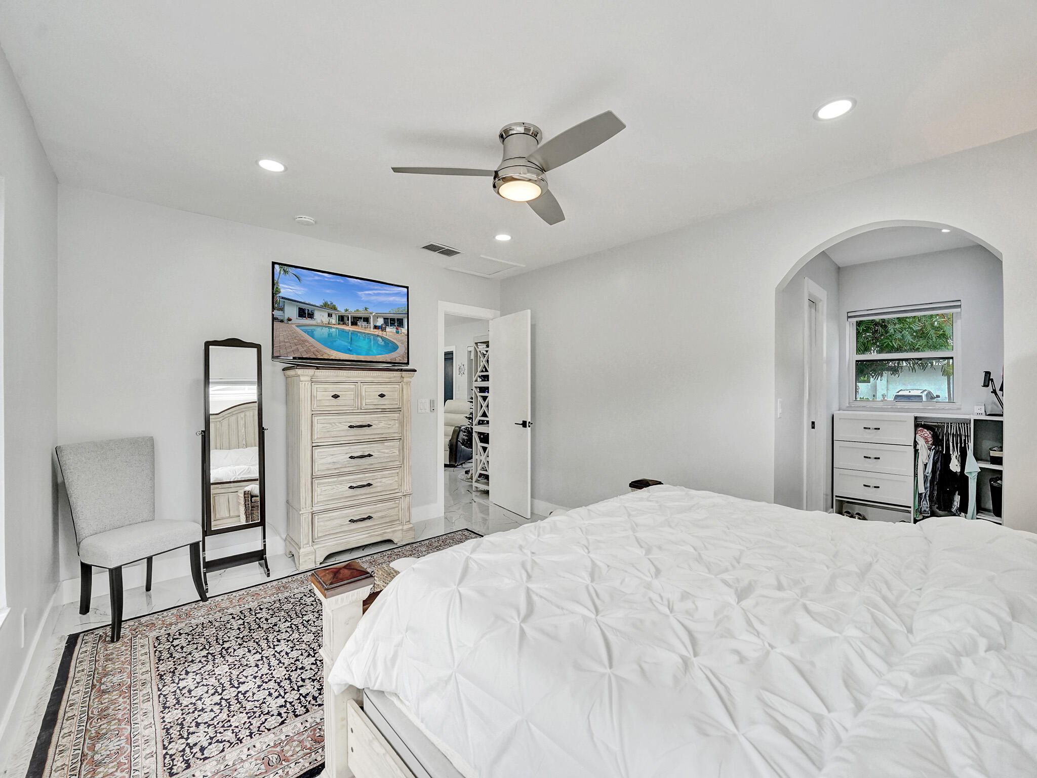 3204 Robbins Road Pompano Beach, FL 33062 - Photo 22 of 37 a bed room with a bed and a chair